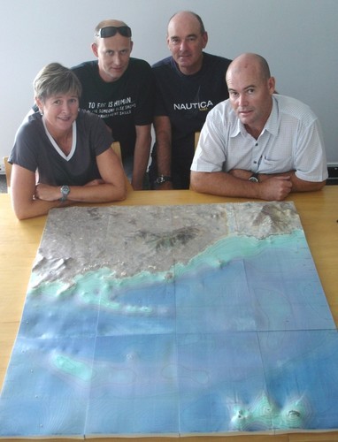 Leslie Egnot of Yachting New Zealand surveys the secret 3D model that helped Kiwis win Gold at the Olympics, with (from left) Martin Brewer, Grant Beck and Peter Dawson © Iain MacIntyre